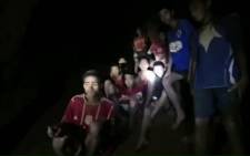 This handout video grab taken from footage released by The Royal Thai Navy late 2 July 2018, shows missing children inside the Tham Luang cave of Khun Nam Nang Non Forest Park in the Mae Sai district of Chiang Rai province. Picture: AFP.