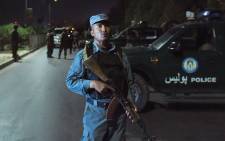 FILE: Afghan security personnel stand guard near the site of an explosion that targeted the elite American University of Afghanistan in Kabul on August 24, 2016. Picture: AFP.
