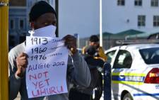 A demonstrator at a protest in front of Parliament against the 'Marikana massacre' on 17 August 2012. Picture: Aletta Gardner/EWN