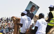 Supporters sit on camels during the ruling All Progressives Congress' (APC) candidate, incumbent President Mohammadu Buhari's presidential campaign rally at the Sanni Abacha Stadium in Kano, on 31 January 2019. Buhari has flag off campaign in Kano, the commercial nerve centre of northern Nigeria to seek re-election at the forthcoming February polls. Picture: AFP
