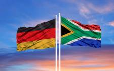 Flags on Germany (l) and South Africa (r). 