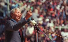 Anti-apartheid leader and African National Congress (ANC) member Nelson Mandela addresses at a funeral of 12 people died during recent township unrests in Soweto, 20 September 1990, in Soweto. Picture: AFP
