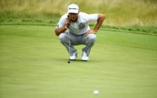 Dustin Johnson of the US lines up a putt on the 18th green during the first round of the 2015 PGA Championship at Whistling Straits on 13 August 2015 in Wisconsin. Picture: AFP.