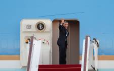 US President Barack Obama boards Air Force One shortly before departing from Capital International Airport in Beijing on 12 November, 2014. Picture: AFP. 