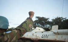 FILE: A member of a patrol of the Bangladeshi contingent of the United Nations Multidimensional Integrated Stabilisation Mission in the Central African Republic (MINUSCA) gestures towards an armoured personnel carrier. Picture: AFP
