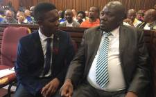 Victor Mlotshwa with his his lawyer ahead of the court proceedings in Middelburg Magistrates Court. Ziyanda Yono/EWN