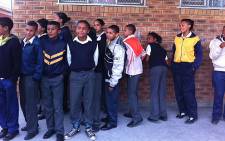 Learners at ACJ Phakade had class while sitting on the floor as the school had no desks or chairs.