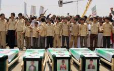 Yemeni children vent anger against Riyadh and Washington on August 13, 2018 as they take part in a mass funeral in the northern Yemeni city of Saada, a stronghold of the Iran-backed Huthi rebels, for children killed in an air strike by the Saudi-led coalition last week. Picture: AFP.