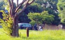 A screenshot of a video showing an attempted hijacking in Rubenstein Drive, Moreleta Park.