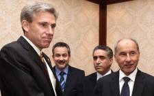 A picture dated June 7, 2012 shows US ambassador to Libya, J. Christopher Stevens (L), shaking hands with Libyan National Transitional Council (NTC) chairman Mustafa Abdel Jalil (R) after presenting his credentials during a meeting in Tripoli. Stevens, and three officials were killed when a mob attacked the US consulate in the eastern city of Benghazi, the interior ministry said on September 12, 2012. Picture: AFP.