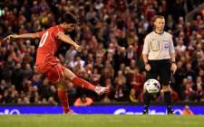 Liverpool's Spanish midfielder Suso scores Liverpool's final penalty during their 14-13 penalty shoot out victory in the English League Cup third round football match between Liverpool and Middlesbrough. Picture: AFP 