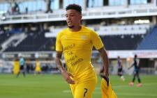 FILE: Dortmund's English midfielder Jadon Sancho shows a 'Justice for George Floyd' shirt as he celebrates after scoring his team's second goal during the German first division Bundesliga football match SC Paderborn 07 and Borussia Dortmund at Benteler Arena in Paderborn on 31 May 2020. Picture: AFP