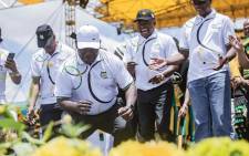 President Cyril Ramaphosa, joined by other senior ANC members, dance during the party's birthday celebrations. Picture: Sethembiso Zulu/EWN.