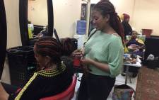 Women have their hair styled at a hairdresser's salon in the Sudanese capital Khartoum on 29 August 2019. Picture: AFP