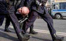 FILE: Police officers detain a man during an unauthorised anti-corruption rally in central Moscow on 26 March, 2017. Picture: AFP.