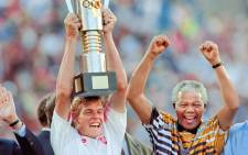 Former South African President Nelson Mandela celebrates with the national squad captain Neil Tovey, holding the trophy, on 3 February, 1996 after South Africa beat Tunisia 2-0 during the Africa Nations Cup soccer final in Johannesburg. Picture: AFP.