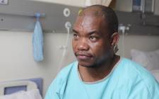 Moleko Bereng, one of the firefighters injured in the Lisbon Bank building fire in Johannesburg, speaks from the Milpark Hospital. Picture: Christa Eybers/EWN
