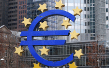 A sculpture featuring the EURO logo is pictured in front of the European Central Bank (ECB) in Frankfurt am Main, western Germany. Picture: AFP.