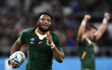 FILE: South Africa's centre Lukhanyo Am runs to score a try during the Japan 2019 Rugby World Cup Pool B match between South Africa and Italy at the Shizuoka Stadium Ecopa in Shizuoka on 4 October 2019. Picture: AFP