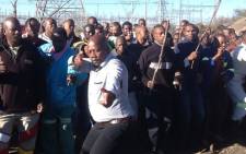 Lonmin miners at Marikana chant ahead of one year anniversary at Lonmin's Marikana mine where 34 striking platinum workers were shot dead by police on 16 August 2012. Picture: Gia Nocolaides/EWN 