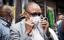 ANC spokesperson Pule Mabe accepts a memorandum of demands from protesting Free State ANC members at the party's Luthuli House headquarters in Johannesburg on 19 October 2020. Picture: Xanderleigh Dookey/EWN