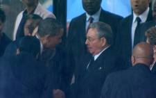 US President Barack Obama greets Cuban President Raul Castro ahead of his speech at FNB during Nelson Mandela's memorial on 10 December 2013. Picture: @lordrich6 via twitter