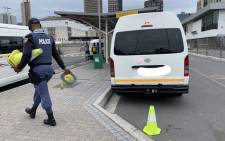 A policeman cordons off an area of the Cape Town station deck following a shooting on 23 November 2020. Picture: Kaylynn Palm/EWN