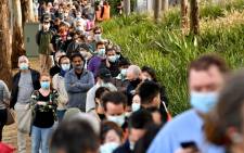 Sydneysiders queue outside a vaccination centre in Sydney on June 24, 2021, as residents were largely banned from leaving the city to stop a growing outbreak of the highly contagious Delta COVID-19 variant spreading to other regions. Picture: AFP: 