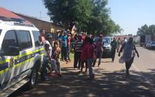 FILE. Police clash with parents at the Roodepoort Primary School as they call for the principal at the school to step down. Picture: Govan Whittles/EWN.