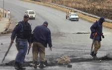 Police clear a road in Noordgesig during a protest. Picture: Taurai Maduna/EWN