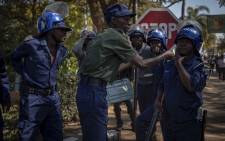 FILE: Protesters marched from the MDC headquarters to the ZEC office at Rainbow Towers, Harare, to protest against the election process on 1 August 2018. They were met by riot police armed with rubber bullets, tear gas, and AKs. Picture: EWN.