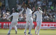 SA bowler Kagiso Rabada (centre) celebrates the dismissal of Sri Lanka batsman Dinesh Chandimal during the second Test between South Africa and Sri Lanka on 3 January 2017 at Newlands Cricket Stadium in Cape Town. Picture: AFP.
