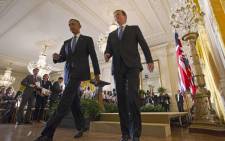 US President Barack Obama(L) and Britain’s Prime Minister David Cameron make their way off the stage at the end of a press conference in the East Room of the White House on 16 January, 2015 in Washington, DC. Picture: AFP