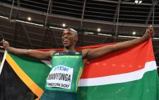 FILE: Gold medallist South Africa’s Luvo Manyonga celebrates after the final of the men’s long jump athletics event at the 2017 IAAF World Championships at the London Stadium in London on 5 August 2017. Picture: AFP.