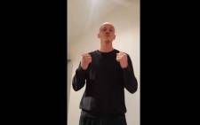 A video grab made on 7 January 2019 shows former boxer Christophe Dettinger broacasting a message of apology for punching police officers during a "yellow vest" protest in Paris. Picture: AFP