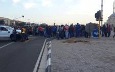 Protesting Dischem workers block the road in Midrand over wage negotiations deadlock. Picture: Supplied.