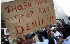 FILE: A Treatment Action Campaign activist with a message for then South African President Thabo Mbeki in August 2007. Picture: AFP.