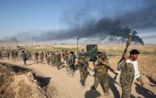 FILE: Iraqi pro-government forces advance towards the city of Falluja on 23 May 2016 as part of a major assault to retake the city from the Islamic State group. Picture: AFP.