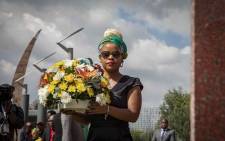 Chris Hani's daughter Lindiwe Hani places flowers on her father's grave at the Thomas Titus Nkobi Memorial Park. Picture: Thomas Holder/EWN