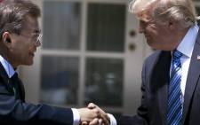 This file photo taken on 30 June 2017 shows South Korea's President Moon Jae-in and US President Donald Trump shaking hands in the Rose Garden of the White House in Washington, DC. Picture: AFP