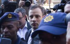 Oscar Pistorius arrives at the High Court in Pretoria under heavy police guard ahead of judgment in his murder trial on 12 September 2014. Picture: Christa Eybers/EWN.