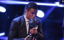 Real Madrid and Portugal forward Cristiano Ronaldo kisses the trophy after winning The Best FIFA Men's Player of 2017 Award during The Best FIFA Football Awards ceremony, on 23 October, 2017 in London. Picture: AFP.