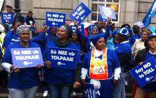 DA members picket outside the Western Cape High Court against Sanral’s application to keep tolling details secret on 4 August 2014. Picture: Siyabonga Sesant/EWN.