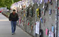 Oklahoma City resident Kevin Fruendt walks past the west fence where dedications are hung to the victims of the Murrah Building bombing during the 15th anniversary observance ceremony of the Murrah Building bombing 19 April, 2010 in Oklahoma City. Picture: AFP.