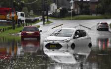 Cars are stranded in floodwaters due to heavy rain in a southwestern suburb of Sydney on 8 March 2022. Picture: Muhammad FAROOQ/AFP