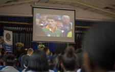 Pupils of FH Odendaal High School in Pretoria watch a memorial video for late Springbok legend Joost van der Westhuizen at a memorial service held at the player's former school on 9 February 2017. Picture: Reinart Toerien/EWN.