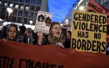 Women holding signs and banners take part in a march staged by feminist, anti-racist and human rights organizations to mark the International Women's Day in Athens on 8 March 2019. Picture: AFP
