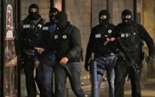 FILE: Members of French police special forces in the northern Paris suburb of Saint-Denis city center, on 18 November, 2015, as French Police special forces raid an appartment, hunting those behind the attacks. Picture: AFP.