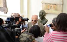 Ahmed Kathrada, politician and previous political prisoner, stands with the new Mandela bust unveiled in Cape Town on Freedom Day. Picture: Anthony Molyneaux/EWN