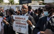 Lawyers protest outside of Prime Minister Ariel Henry’s private home to force the government to relocate the civil court to a safer area, in Port-au-Prince, Haiti on April 8, 2022. Valerie Baeriswyl / AFP